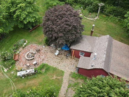 Brewster Cape Cod vacation rental - Private fire pit in a large, brick patio.