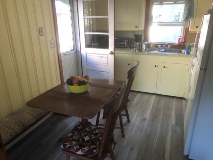 Yarmouth Cape Cod vacation rental - Sunny kitchen with seating area and door leading outside