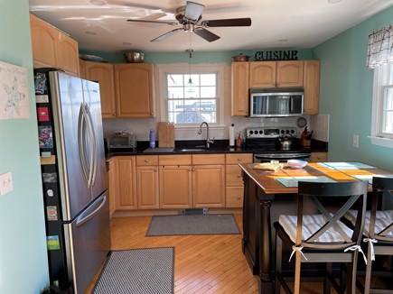 Sandwich, Town Neck Beach Cape Cod vacation rental - Fully equipped Kitchen with island - open to Dining area table