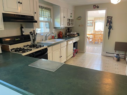 West Yarmouth Cape Cod vacation rental - Kitchen is set right off sunroom with large dining  area