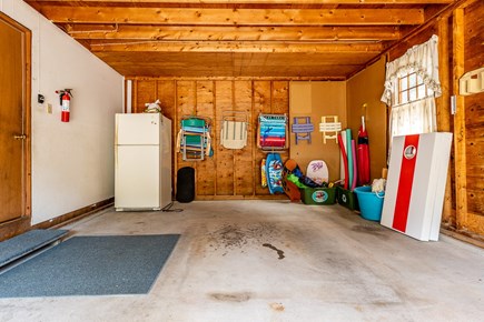 Eastham Cape Cod vacation rental - Garage with extra fridge, beach chairs and corn hole.