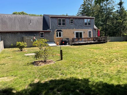 North Eastham Cape Cod vacation rental - Large fenced-in back yard; outdoor shower and deck