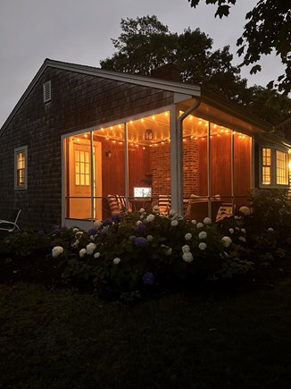 Dennis Port Cape Cod vacation rental - Screen porch at night