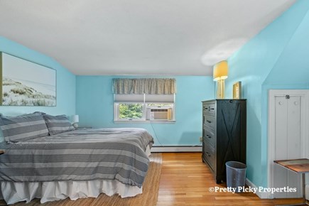 Brewster Cape Cod vacation rental - Second floor bedroom with a full-size double and a twin bed. Wall mounted mini splits have replaced the window unit AC.