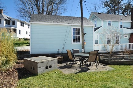 Onset MA vacation rental - Rear yard with outdoor grill, firepit, and table/chairs