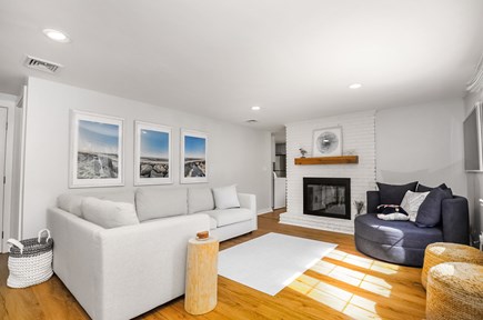 Yarmouth Cape Cod vacation rental - Living room w L-sofa, oversized chair, fireplace, 4K TV