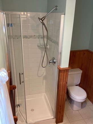 Dennis Port Cape Cod vacation rental - View from vanity sink of second bath w/ bifold glass door shower