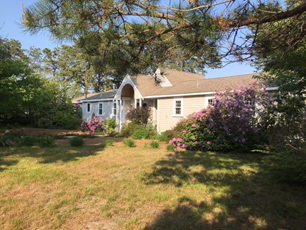 South Dennis Cape Cod vacation rental - Front view showing parking and horseshoe/cornhole game area