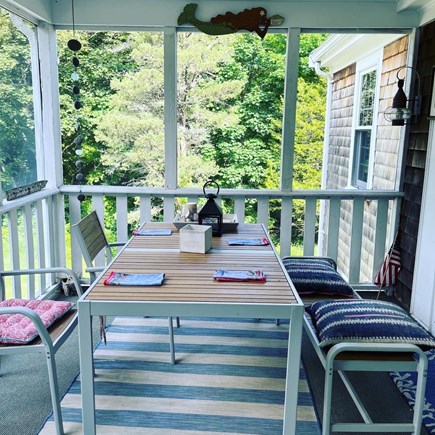 Barnstable Village Cape Cod vacation rental - Enjoy the porch dining area overlooking the private yard!