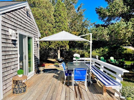 E. Falmouth Cape Cod vacation rental - Deck area with seating and table