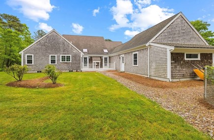 Harwich Cape Cod vacation rental - Backyard and shed containing kayaks, beach gear and bikes!