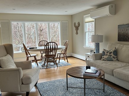 Harwich - Long Pond area Cape Cod vacation rental - Living  room with fireplace and game table