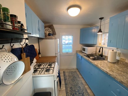 Dennis, Sea Rose Cottage Cape Cod vacation rental - Kitchen with gas stove and microwave, full size fridge