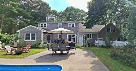 East Falmouth Cape Cod vacation rental - Patio dining by the pool