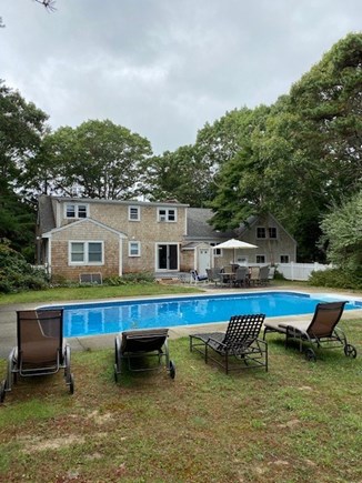 East Falmouth Cape Cod vacation rental - Back yard with pool, deck and patio