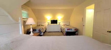 East Falmouth Cape Cod vacation rental - Second floor bedroom with a queen bed and two twin beds