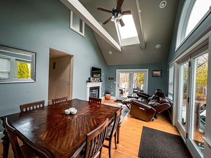 EASTHAM Cape Cod vacation rental - Dining Room featuring dining table, reclining couch & smart TV