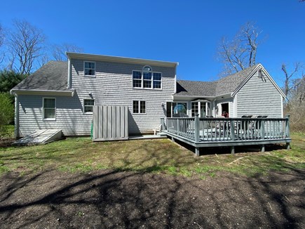 North Eastham Cape Cod vacation rental - Private backyard, deck with BBQ, table & chairs, outdoor shower.