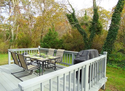 North Eastham Cape Cod vacation rental - Back deck with dining area, gas grill, showing privacy