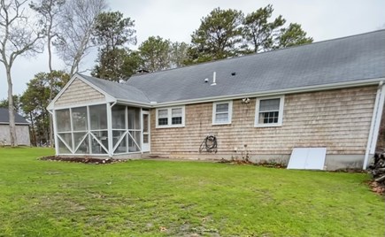 Dennis Cape Cod vacation rental - Backyard. Fire pit and outdoor shower coming in the spring 2023.