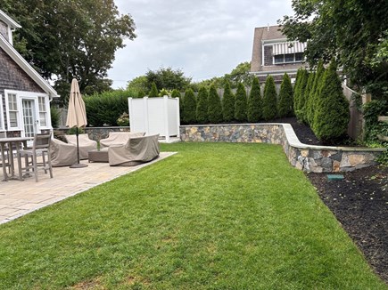 Harwich Port Cape Cod vacation rental - Side yard of main house offers plenty of space to gather.