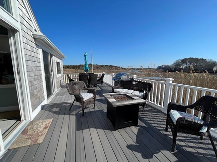 Hyannis Cape Cod vacation rental - Spacious back deck for dining and social area with gas firepit.