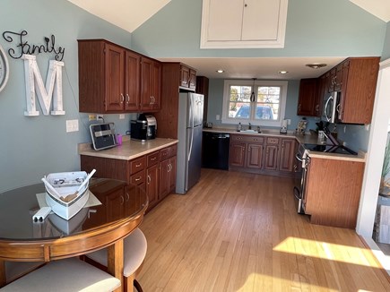 Hyannis Cape Cod vacation rental - kitchenette seating with 4-seat pub table overlooking the marsh