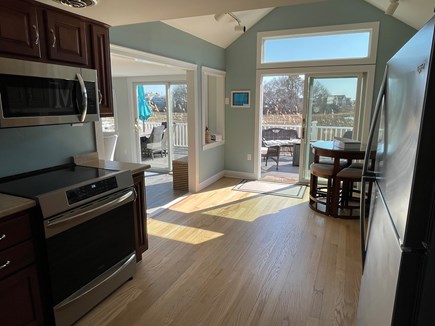 Hyannis Cape Cod vacation rental - spacious kitchen with new induction stove, microwave and fridge