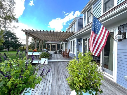 Orleans, Rock Harbor Cape Cod vacation rental - The deck overlooks the front yard, accessible from the main floor