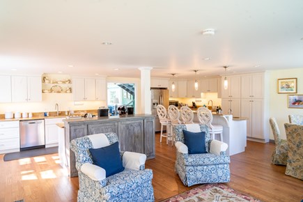 Orleans, Rock Harbor Cape Cod vacation rental - Sunny kitchen and dining area with hidden in-cabinet television.
