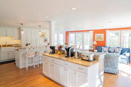 Orleans, Rock Harbor Cape Cod vacation rental - Modern, sunlit, open-concept kitchen with in-cabinet television.