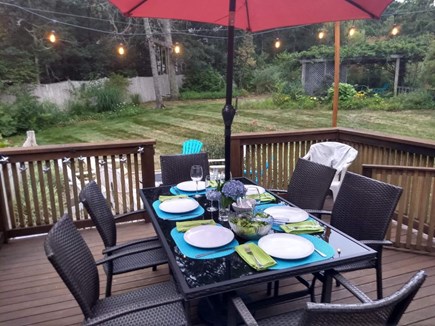 Brewster Cape Cod vacation rental - Deck and view of yard, pergola, swings