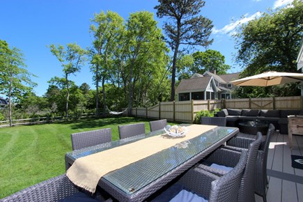 Dennis Cape Cod vacation rental - Large outdoor dining table for dinner under the stars