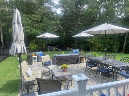 Sandwich Cape Cod vacation rental - Large patio with 3 seating areas and fire pit.