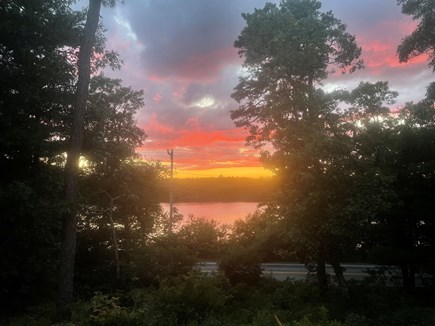 Sandwich Cape Cod vacation rental - Sunset from front porch over pond