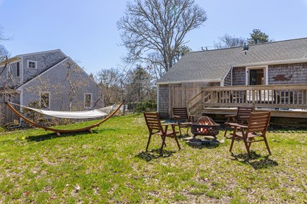 Harwichport Cape Cod vacation rental - Back yard with firepit