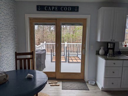 Harwich Cape Cod vacation rental - Sliders off the kitchen to large deck, perfect for family dinners