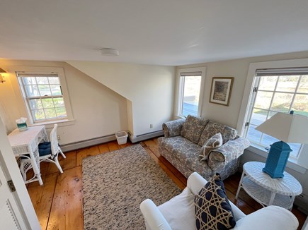 Orleans Rock Harbor Cape Cod vacation rental - Upstairs sitting area with desk which has a pull-out twin sofa.