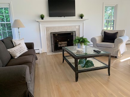Falmouth Cape Cod vacation rental - Relaxing living room with fireplace and TV