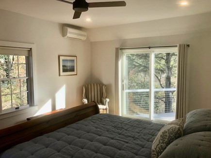 Orleans Cape Cod vacation rental - First floor primary bedroom suite with King bed and deck access