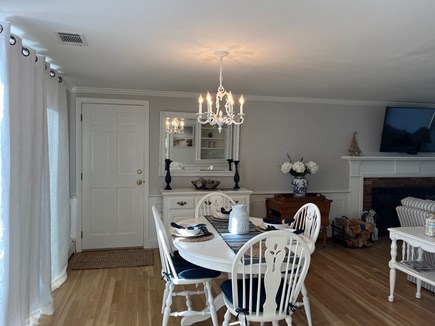 Yarmouth Cape Cod vacation rental - Dining area open to kitchen and living room areas leads to deck.