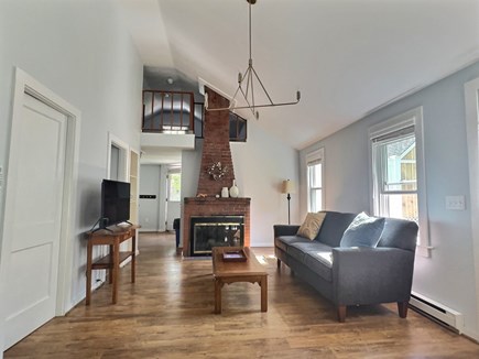 Brewster Cape Cod vacation rental - Spacious living room with a working electric fireplace