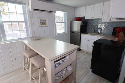 Dennis Port Cape Cod vacation rental - Kitchen with island for dining (stools on both sides)