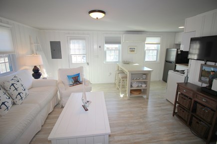 Dennis Port Cape Cod vacation rental - Living room with TV open to kitchen