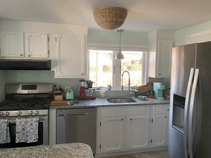 South Dennis Cape Cod vacation rental - Kitchen with walk-in pantry & stainless steel appliances 
