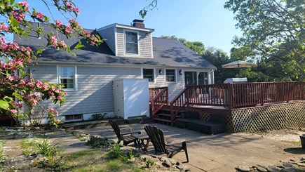 Dennis Port Cape Cod vacation rental - The backyard with large patio, grill, and outdoor shower.