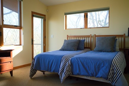 Falmouth Cape Cod vacation rental - Upstairs bedroom with two twin beds and garden-view balcony