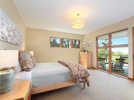 Falmouth Cape Cod vacation rental - Downstairs bedroom with queen bed, ocean view, and attached deck
