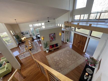 Falmouth Cape Cod vacation rental - Open concept view of foyer and dining area from staircase