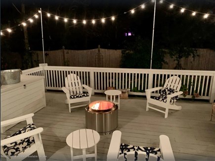 Chatham Cape Cod vacation rental - Furnished Back Porch - 4 Adirondack Chairs around Solo Stove
